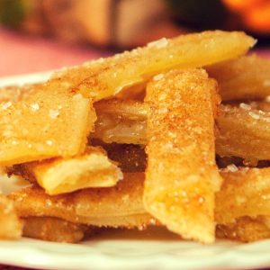 The Most Incredible Baked Apple Pie Fries: Delicious, crispy and healthy apple fries tossed with cinnamon sugar and baked to perfection golden brown color, drizzled with caramel sauce! All you need is a few simple ingredients: store bought pie crust, apple pie filling, cinnamon and sugar, nutmeg and milk. Quick and easy recipe, party desserts. Vegetarian. Video recipe.