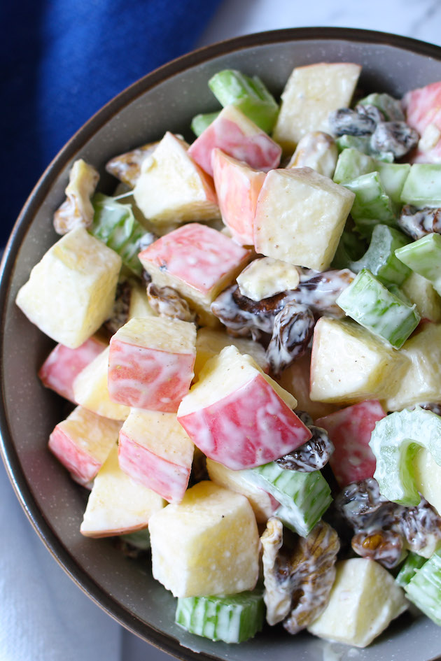 Creamy apple walnut salad in a serving bowl 