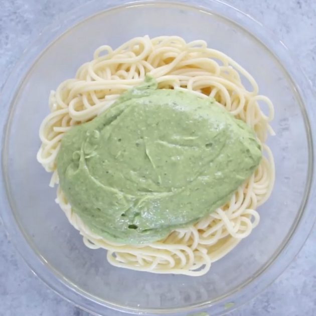 Here is the emerald green avocado pasta sauce on spaghetti in a bowl
