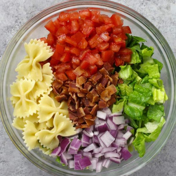 Here is a photo of the ingredients for BLT Pasta Salad arranged in a mixing bowl