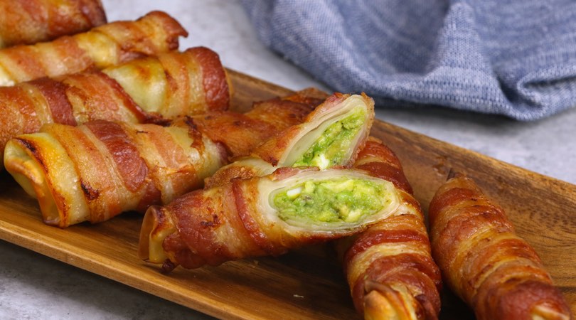 Bacon-wrapped Spring Rolls – filled with avocado, eggs, red onion, jalapeno, salt and pepper and wrapped in bacon, then baked until crispy. Easy to make for breakfast or brunch and great as a grab-and-go option for busy weekday mornings. Video recipe. AD