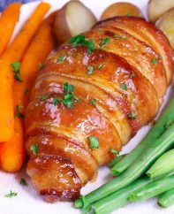 This Brown Sugar Bacon Wrapped Chicken is a simple recipe that everyone will love. Chicken is rubbed with brown sugar and seasonings, wrapped in bacon and baked to golden crispy perfection!