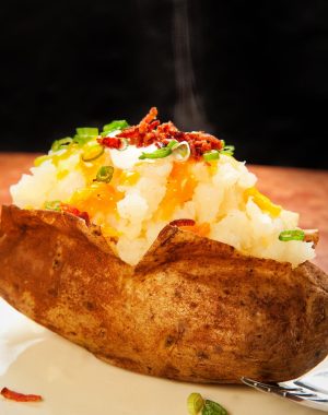 The perfect baked potato topped with toppings