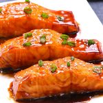 This Baked Teriyaki Salmon with Green Beans and Carrots is an irresistible dinner that’s healthy and flavorful - moist salmon coated with a homemade sticky and sweet teriyaki sauce and baked to tender flaky perfection. The best Baked Salmon recipe ever! #teriyakiSalmon #bakedSalmon