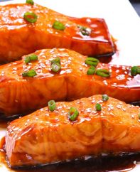 This Baked Teriyaki Salmon with Green Beans and Carrots is an irresistible dinner that’s healthy and flavorful - moist salmon coated with a homemade sticky and sweet teriyaki sauce and baked to tender flaky perfection. The best Baked Salmon recipe ever! #teriyakiSalmon #bakedSalmon