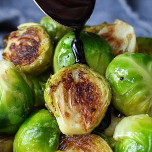 Balsamic Brussel Sprouts are an easy but delicious and healthy side dish. Roasting Brussel sprouts in the oven at a high temperature and then drizzled with balsamic glaze ensures the tender yet crispy perfection.