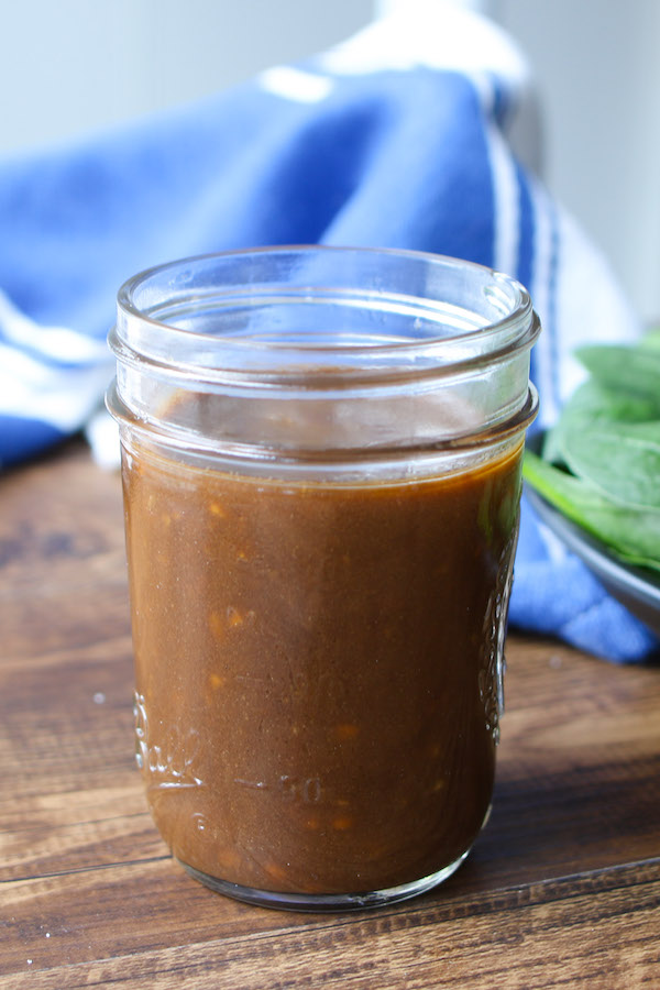 Homemade Balsamic vinaigrette stored in a mason jar and made with balsamic vinegar, extra virgin olive oil and Dijon mustard, garlic and optional honey