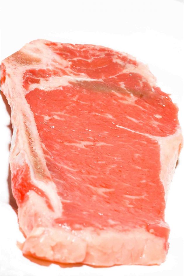 A raw Kansas City strip steak