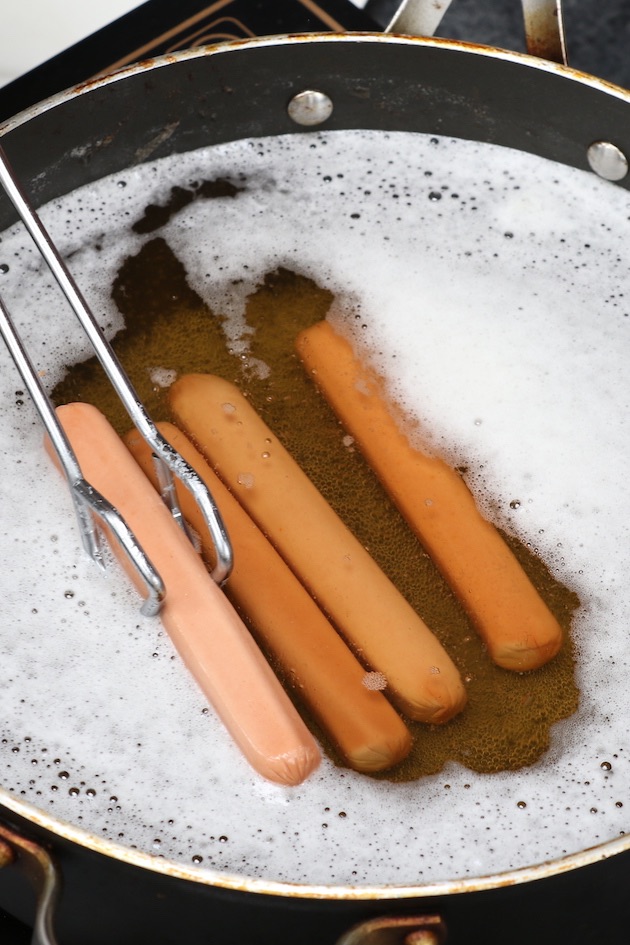 Boiling hot dogs in beer for a mellower flavor