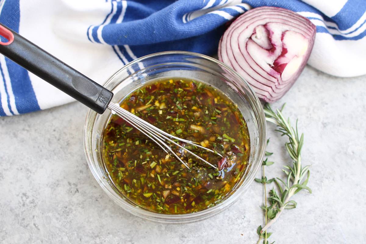 Showing how to make flank steak marinade. Mixing ingredients in a mixing bowl.