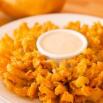 This mouthwatering Blooming Onion is crispy on the outside and tender on the inside, rivalling that of Outback Steakhouse. I will share with you the secrets to make this most impressive-looking appetizer and you will make it again and again… Plus video recipe tutorial! #bloomingOnion