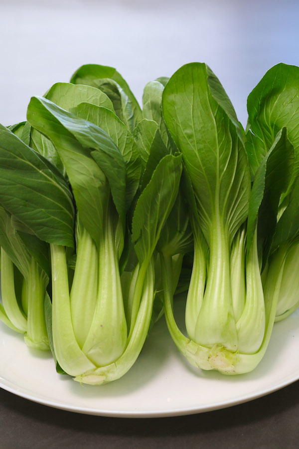Bok choy or pak choi (上海青) is a type of Chinese cabbage and it’s in the cabbage family with high amounts of nutrients and vitamin.  It tastes best when the leaves are slightly wilted while the bottom is still crispy and crunchy. 