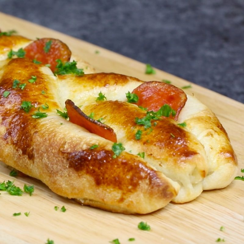 Closeup of braided pepperoni pizza before cutting