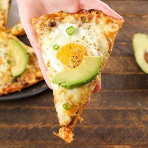 Easy Cheesy Breakfast Pizza With Sausage And Eggs – the easiest and fun breakfast that comes together in no time. All you need is a few simple recipes: your favorite sausage, pizza crust, salsa, green onions, Jack cheese, eggs, salt and pepper. It’s the perfect hearty breakfast or brunch recipe to serve to a crowd! Great for a holiday such as Easter, mother’s day or father’s day brunch. Quick and easy video recipe. | Tipbuzz.com
