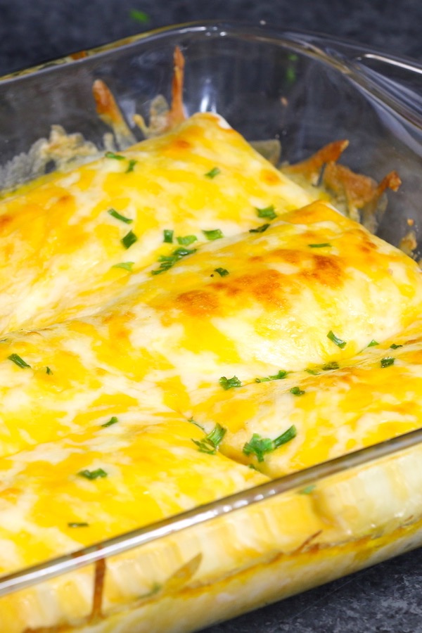 Burrito Casserole is an easy family favorite recipe!  Lean ground beef is cooked with beans, onions, corn and seasonings, and then wrapped with flour tortillas. The burritos are placed in a baking dish, covered with cheese and baked until golden brown. 