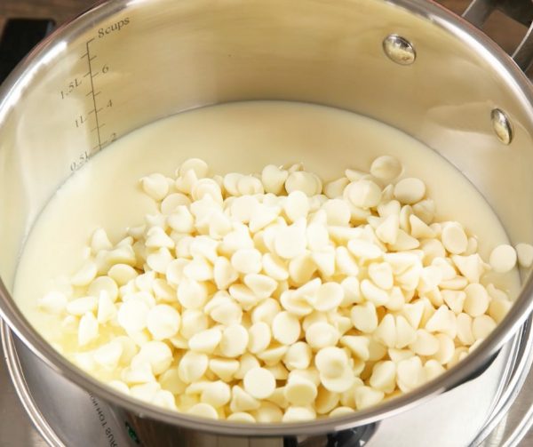 This photo shows a saucepan containing the ingredients for making cake batter fudge