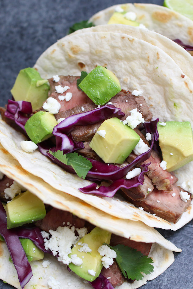 Steak tacos are also called carne asada tacos in Spanish - this photo shows a simple steak taco made with sirloin steak and flour tortilla