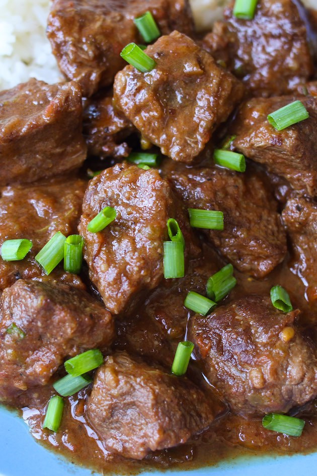 Closeup of Carne Guisada showing its delicious chunks of beef in a rich brown gravy