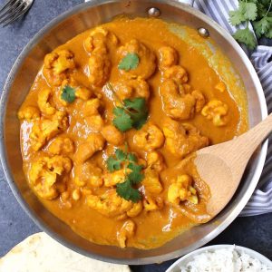 Cauliflower Curry is a rich, creamy and aromatic dish that my whole family loves! This easy coconut curry is loaded with tender cauliflower simmered with authentic spices and is cooked in one pot in under 30 minutes.