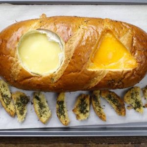 Two Cheese Bread Bowl – Flavorful, fondue-like camembert and cheddar cheese baked inside of bread loaf. Served crispy Italian and herb seasoned bread slices. So Good! This cheese dip recipe is a quick and easy snack recipe that’s perfect for a holiday party or Super Bowl party. Vegetarian, video recipe.