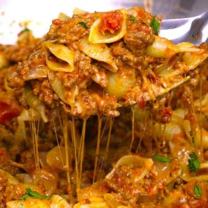 One Pot Cheesy Taco Pasta – One of the easiest quick dinner recipes. It’s loaded with ground beef and shredded cheddar cheese. So delicious. This simple and easy recipe comes together in 20 minutes. Quick and easy recipe. Video recipe.