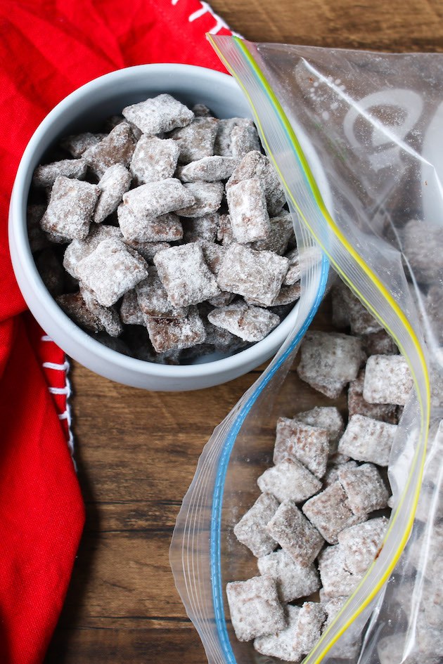 Chex Mix Muddy Buddies after being coated with powdered sugar in a ziplock bag