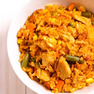 Chicken Fried Rice with eggs, chicken, rice, peas, green beans, onion, corn and carrots in under 20 minutes better than your favorite Chinese takeout restaurant. Irresistibly delicious. #ChickenFriedRice #FriedRice