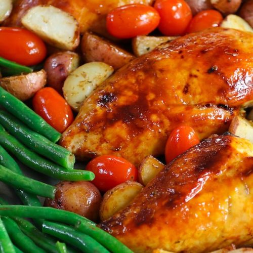 It doesn’t get tastier or healthier than this tender and juicy Chicken with Potatoes and Green Beans. It’s a simple one-pan wonder dish seasoned with Italian spices and roasted to perfection. Easy to prepare with quick cleanup, it’s guaranteed to please! #BakedChickenBreast #ChickenPotatoesGreenbeans