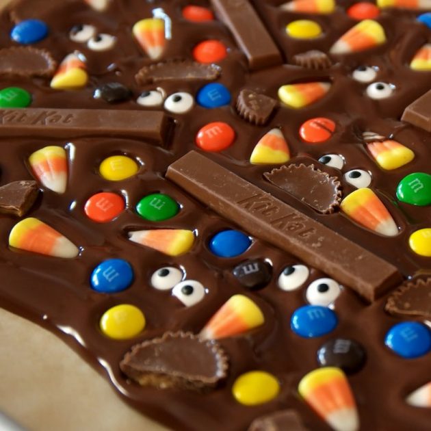 This photo shows freshly made Halloween Chocolate Bark on a baking sheet
