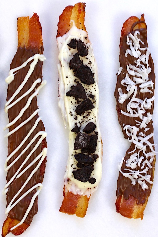 Overhead view of this chocolate covered bacon recipe with white chocolate drizzle, crushed oreos and shredded coconut as toppings