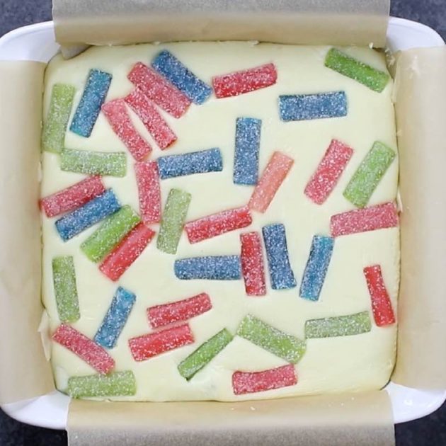 Chocolate fudge with Sour Punch candy for the holidays, shown in a square baking pan