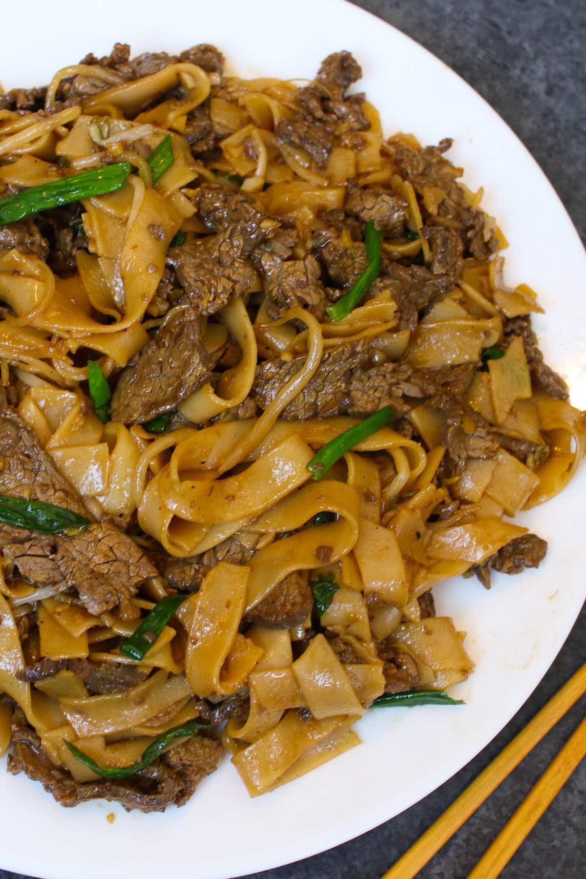 Freshly made chow fun on a serving plate