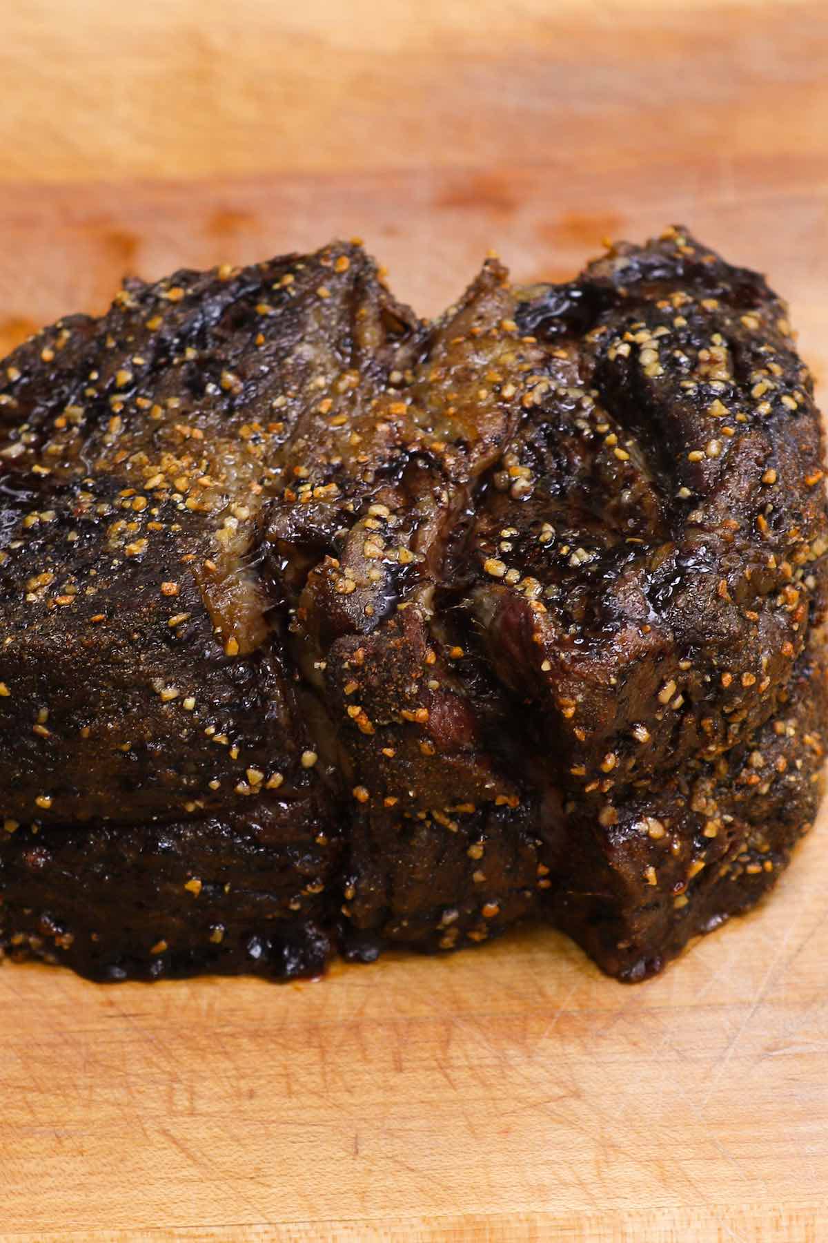 Perfectly smoked chuck roast showing bark on the outside