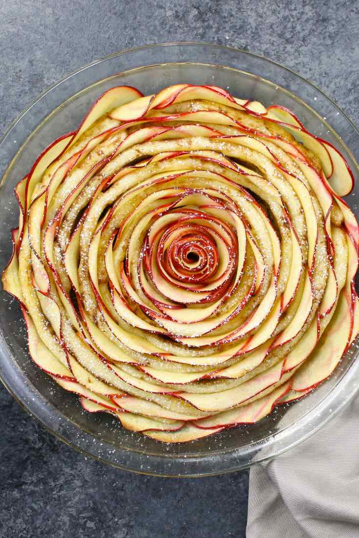Wow your guests with this gorgeous and delicious Cinnamon Roll Apple Rose Tart. It’s so easy to make and are perfect for any party. Made with fresh apples. All you need is only 5 simple ingredients: cinnamon roll dough, red apples, lemon juice, brown sugar and butter. So beautiful! Quick and easy recipe. Vegetarian. Video recipe. | Tipbuzz.com 