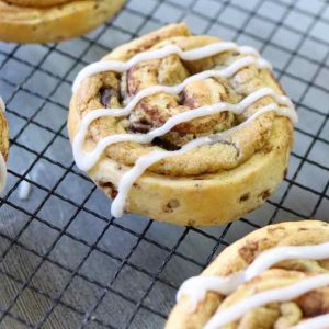 Homemade chocolate chip cinnamon rolls with icing on top made with just 3 ingredients