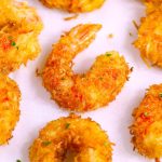 These Coconut Shrimp make an irresistible appetizer that's tender on the inside, and crispy, sweet and crunchy on the outside. They're mouthwateringly delicious and will be the first to go at a party! Plus recipe video tutorial!
