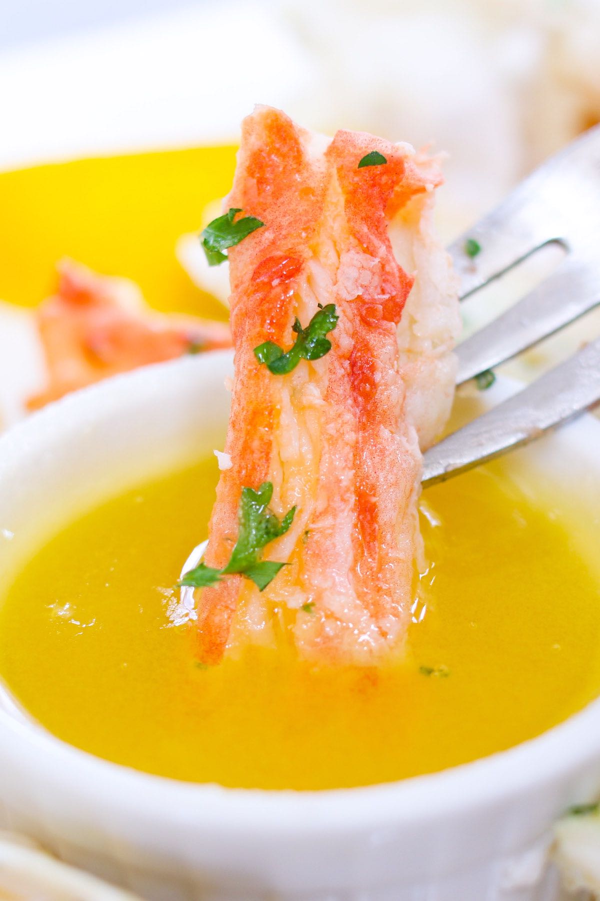Dipping crab legs in clarified butter.