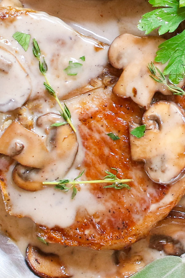 Cream of Mushroom Pork Chops with juicy and tender pork chops smothered in rich and creamy mushroom soup! This comforting Mushroom Pork Chops dish makes an easy dinner recipe for busy nights with one pan and 30 minutes! 