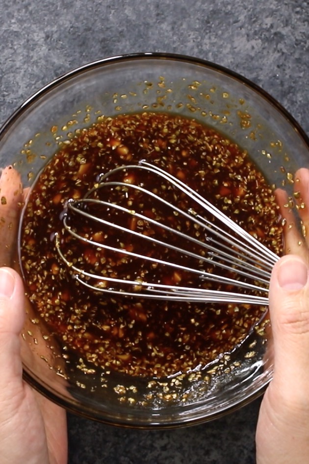 Brown sugar garlic sauce made of brown sugar, garlic, soy sauce and ketchup in a clear bowl