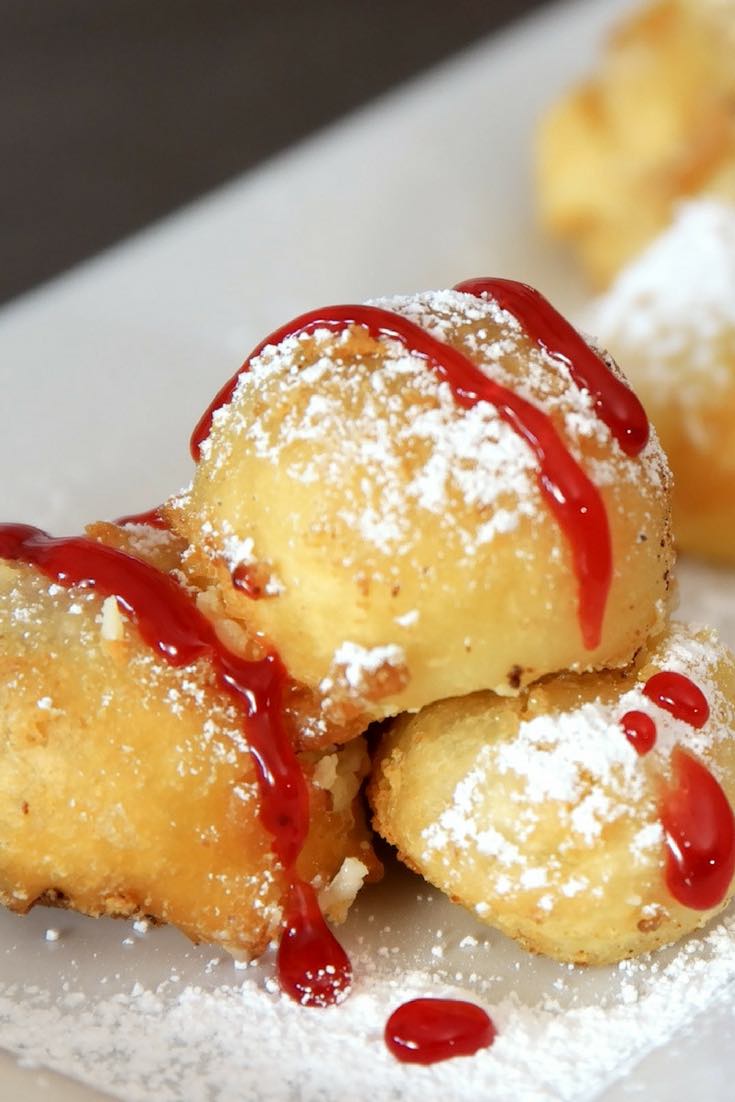 Crispy & Creamy Deep Fried Cheesecake – Crispy outside and creamy inside! you can’t resist this delicious dessert made with your favorite frozen or leftover cheesecake. It only requires a few simple ingredients: flour, baking powder, salt, sugar, milk and oil. It’s great for a party, cheat days or a midnight snack. So yummy! No bake dessert. Vegetarian. Video recipe. | tipbuzz.com