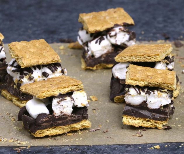 Square s'mores pieces showing graham crackers, marshmallows and semisweet chocolate