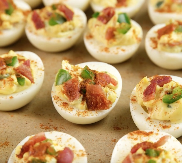 This photo shows the final steps in preparing Deviled Eggs with Bacon before serving