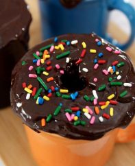 5 Minute Donut Mug Cake – A creamy, fluffy, delicious cake in a mug, ready in 5 minutes. It only requires a few simple ingredients: flour, sugar, baking powder, oil, milk, vanilla, chocolate chips, cream and nutmeg. So good and easy to make for the perfect dessert or snack. No bake. Vegetarian. Video recipe. | tipbuzz.com