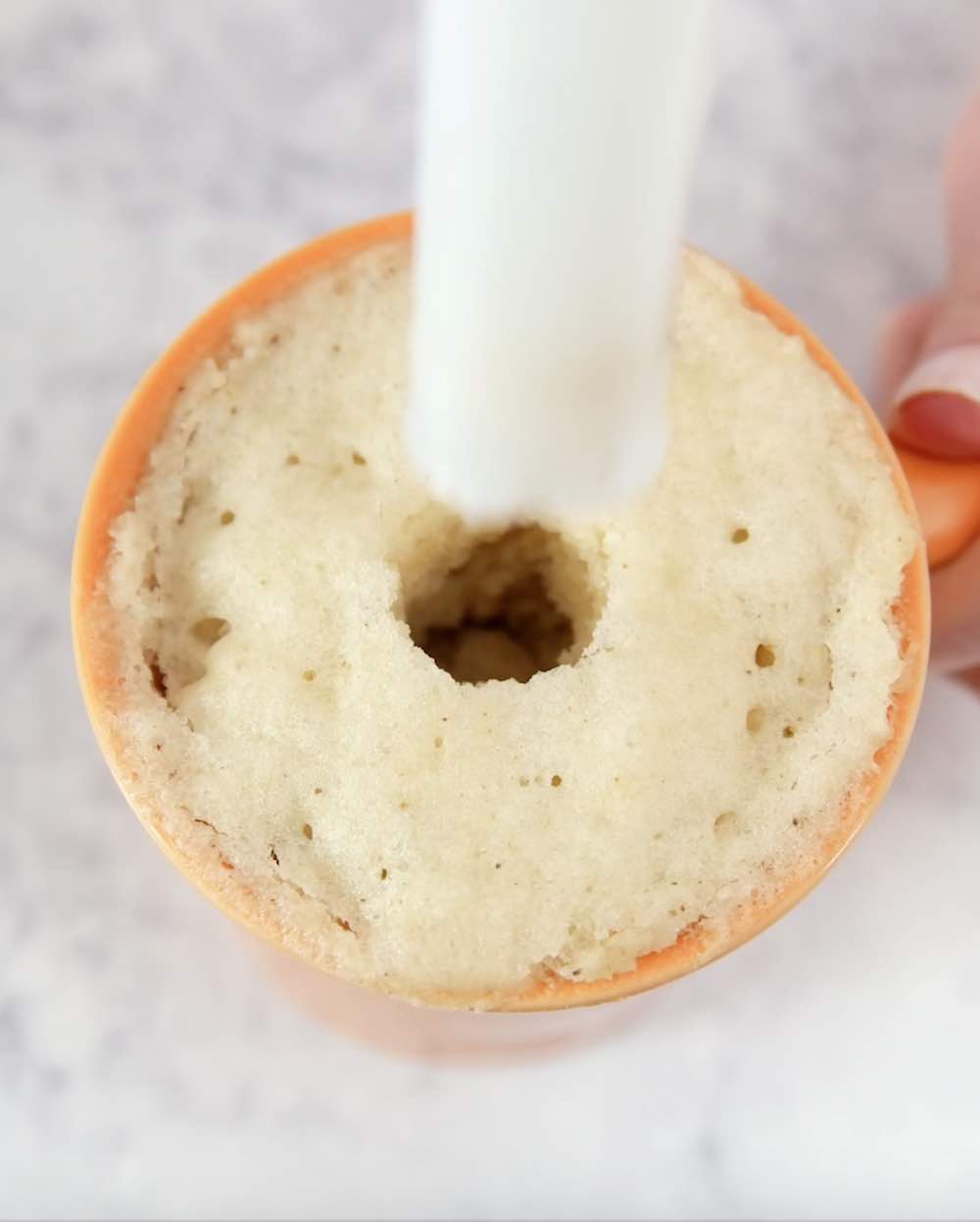 5 Minute Donut Mug Cake – A creamy, fluffy, delicious cake in a mug, ready in 5 minutes. It only requires a few simple ingredients: flour, sugar, baking powder, oil, milk, vanilla, chocolate chips, cream and nutmeg. So good and easy to make for the perfect dessert or snack. No bake. Vegetarian. Video recipe. | tipbuzz.com