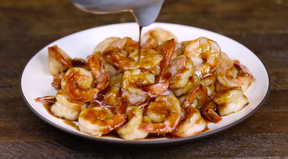 Drizzle thickened teriyaki sauce onto the cooked shrimp