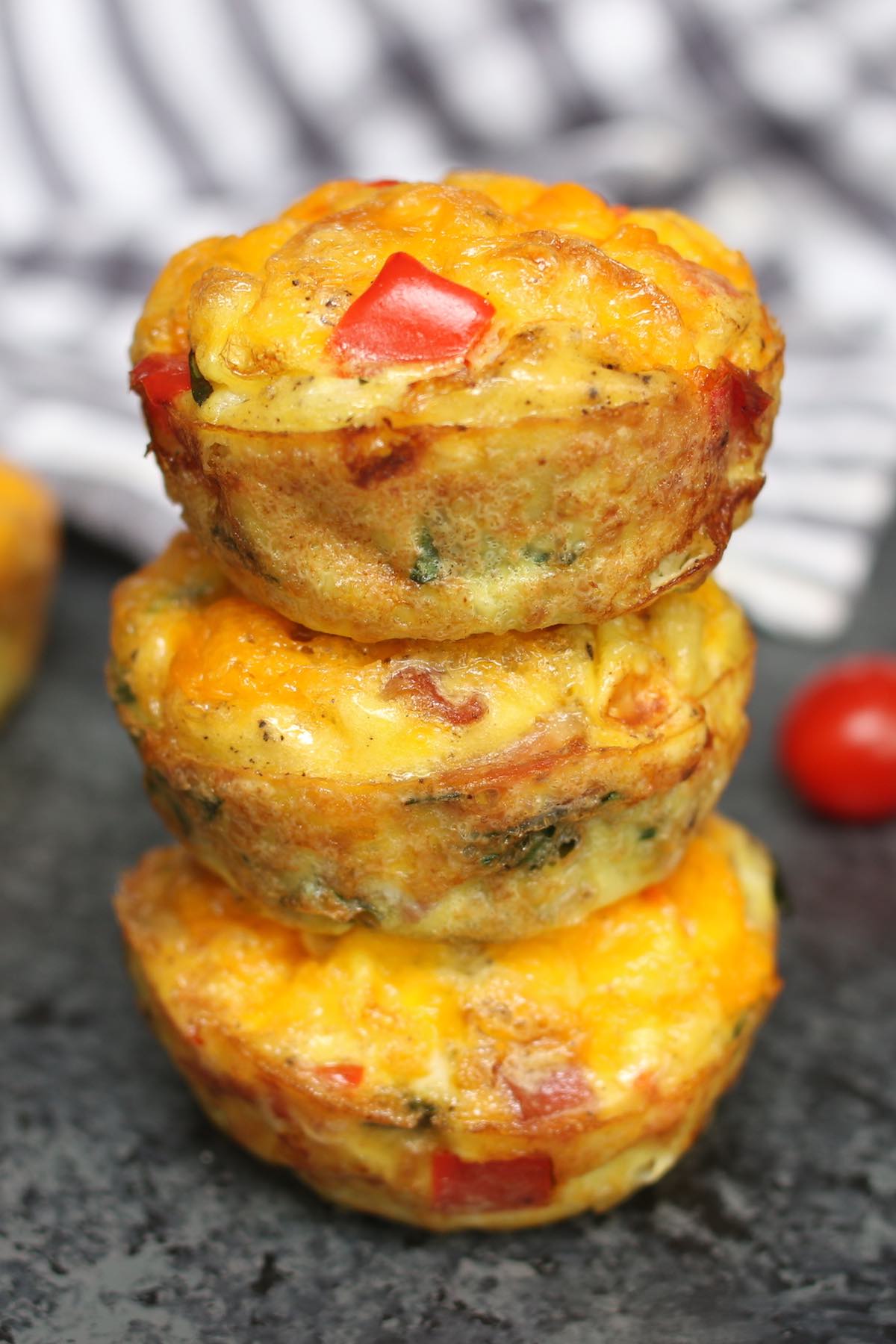 These freezer-friendly Egg Muffins are made with eggs, cheese, bacon, spinach, onions, and bell peppers,. An easy make-ahead recipe, they only takes a few minutes to throw together. These breakfast muffins are delicious, healthy and nutritious, perfect for busy mornings!