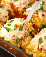 Easy, cheesy and healthy vegetarian lasagna roll ups – really easy to make and are a “no-guilt” way to enjoy the pleasure of lasagna. All you need is a few simple ingredients: lasagna noodles, zucchini, ricotta cheese, parmesan cheese, mozzarella, oil, garlic, egg, marinara and fresh basil for garnish. A perfect healthy dinner for the whole family! Quick and easy dinner recipe, vegetarian, healthy recipe. | Tipbuzz.com