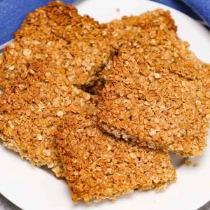 Traditional British Flapjacks are delicious bars of oats and golden syrup, baked until they’re lightly brown. Flapjacks are similar to granola bars and are made with simple, wholesome ingredients you probably already have on hand.