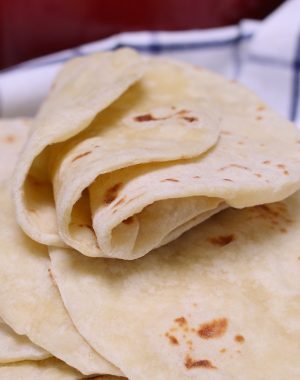 Homemade Flour Tortillas are soft, tender and fluffy – a delicious Mexican thin flatbread made from scratch! It’s easy to make with only 5 simple ingredients, and can be done completely by hand!