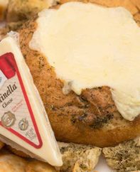 Stella's Fontinella cheese goes into melty perfection on this Cheese Fondue in a Bread Bowl recipe